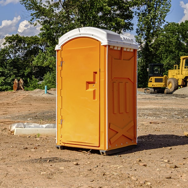 what is the cost difference between standard and deluxe portable restroom rentals in Caney